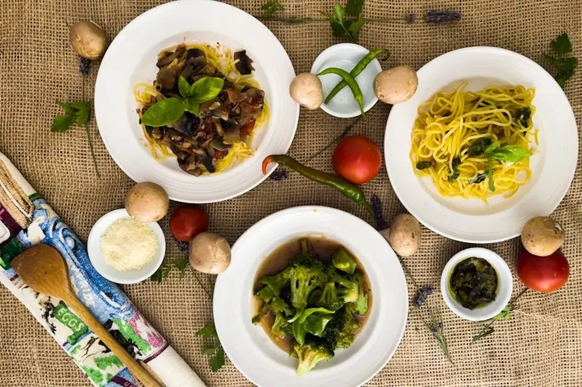 How Italy's Regional Histories Shaped Its Food 3 Pasta with leafy greens in a white ceramic bowl.