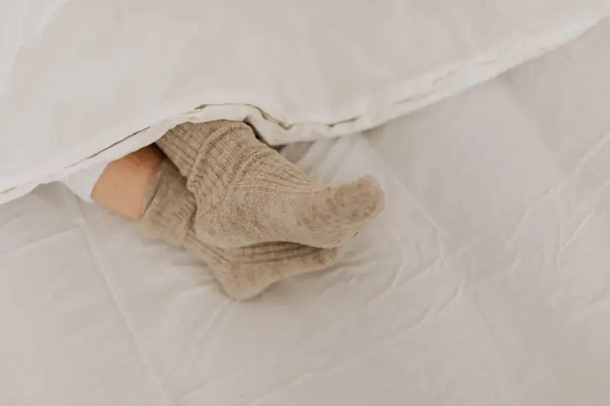 Is the heat keeping you awake? Put on some socks!