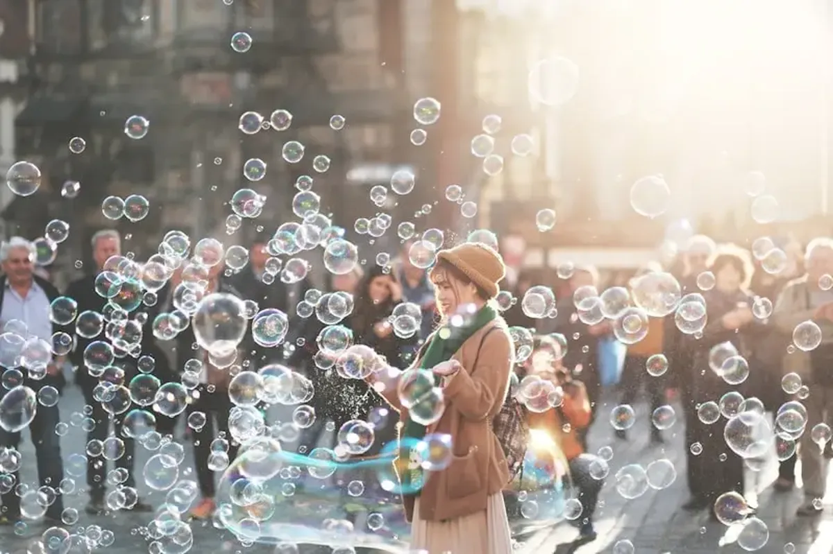 Why Small Wins Matter in Sports and Life 3 A woman standing outdoors, surrounded by bobbles during the daytime.