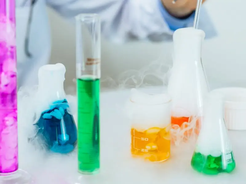 Vibrant and colorful laboratory scene with beakers and smoke showcasing a chemistry experiment.
