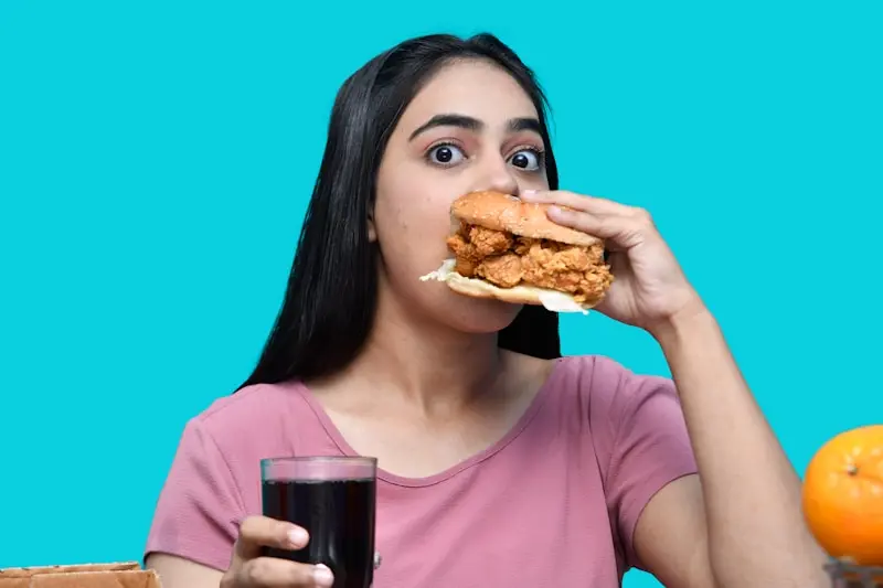 How to Stop Treating Food Like the Enemy 3 A woman eating a sandwich