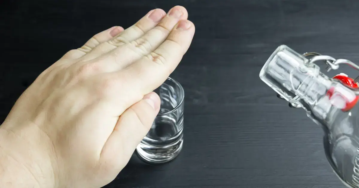 Even ‘Moderate’ Drinking Raises Your Dementia Risk 4 a hand covering a glass