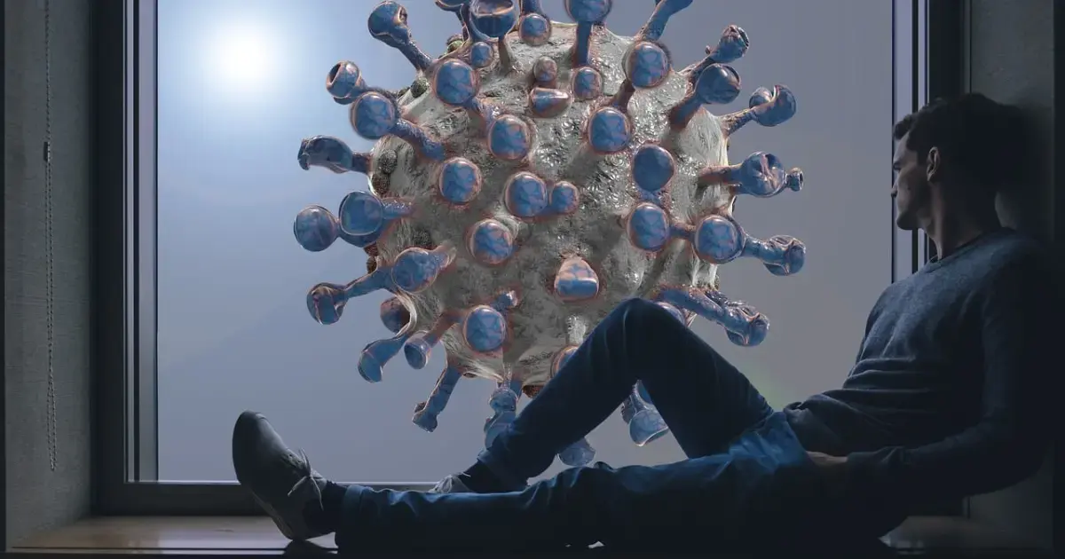 a person standing next to an image of the coronavirus