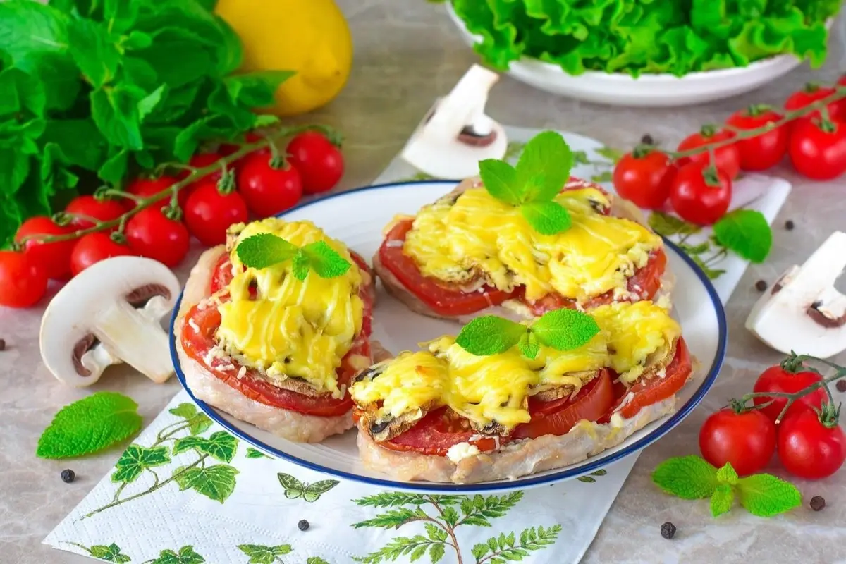 Baked meat and vegetables on a plate.