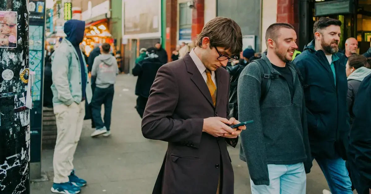 Nomophobia: Could You Live Without Your Phone? 4 A man walking down the street with a smartphone
