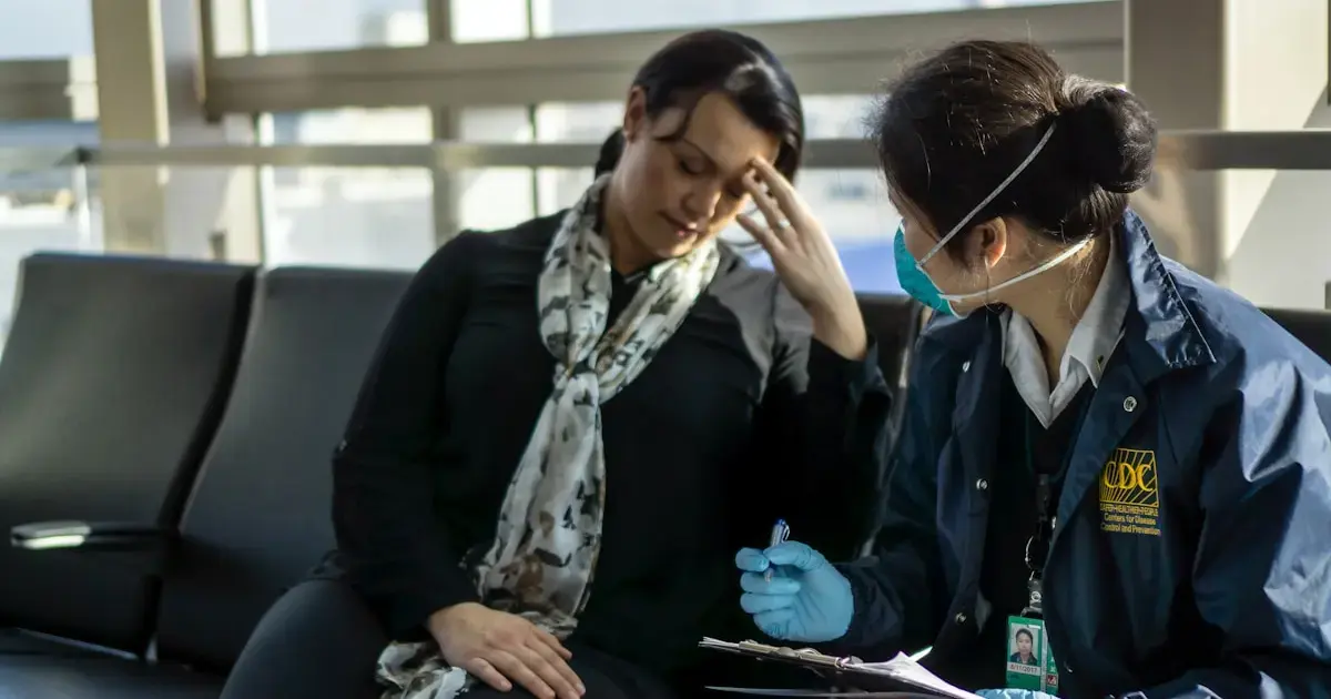 A woman consulting with a doctor at the airport.