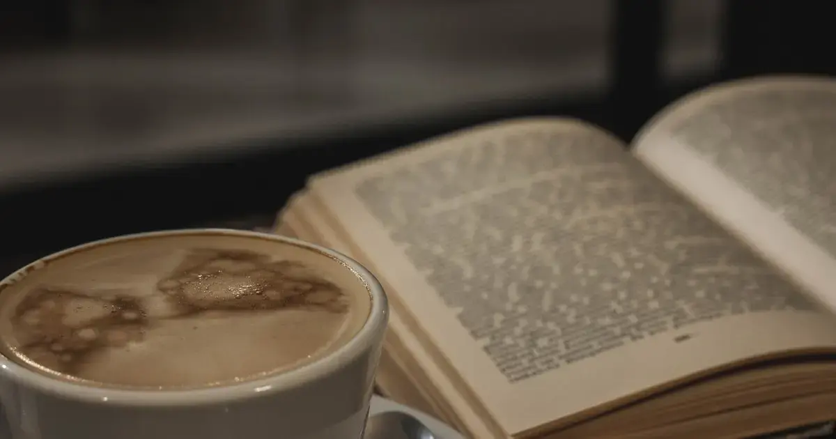 How Your Morning Coffee Could Lower Dementia Risk 4 A cup of coffee and a book on the table.