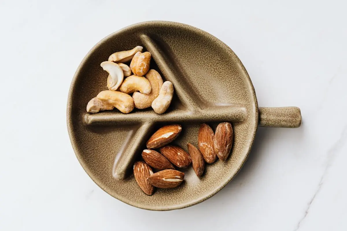 Calorie Counting Is Outdated — What Actually Controls Your Weight 5 Almonds on a plate.