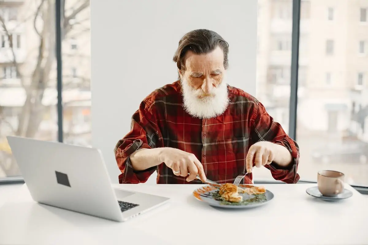 A man eating at a table.