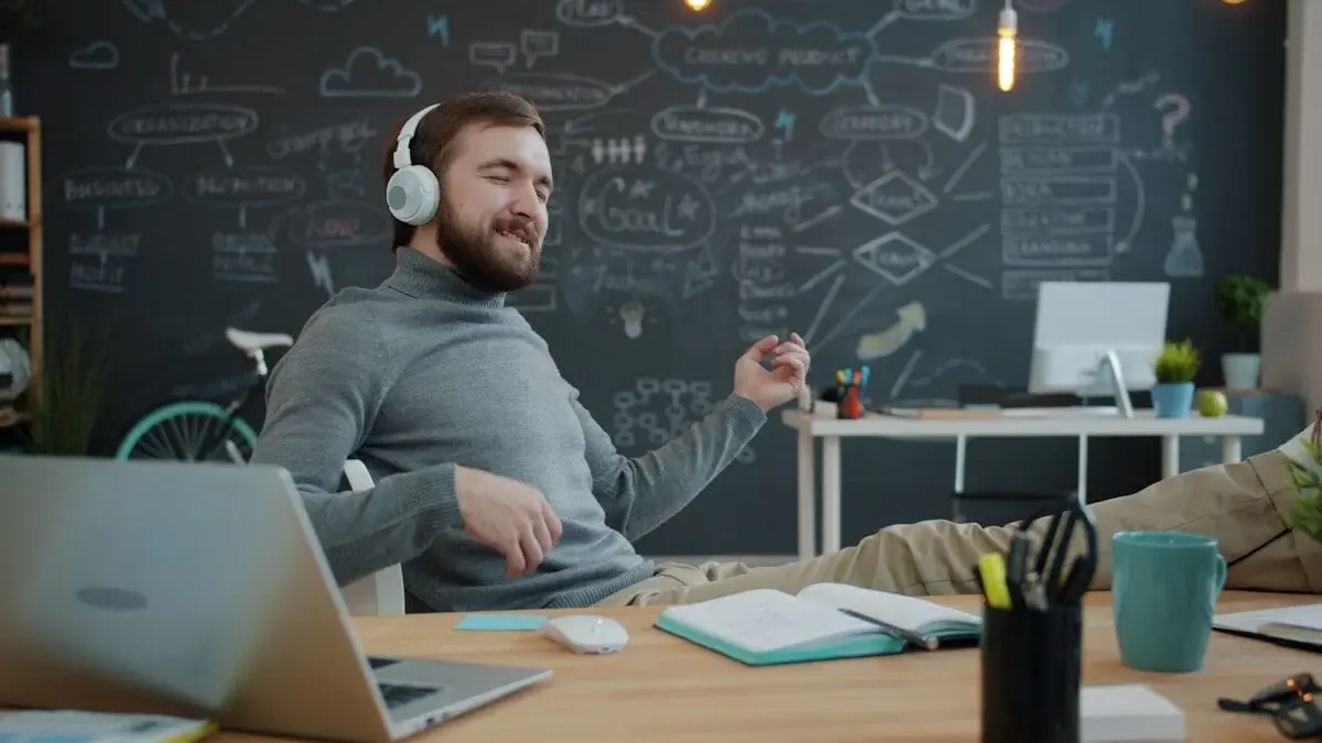 person listening to music at their desk