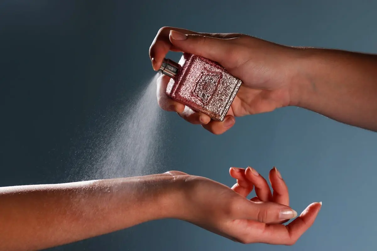 Why Your Perfume Fades So Fast — and How to Make It Last 5 Spritzing perfume on the wrist