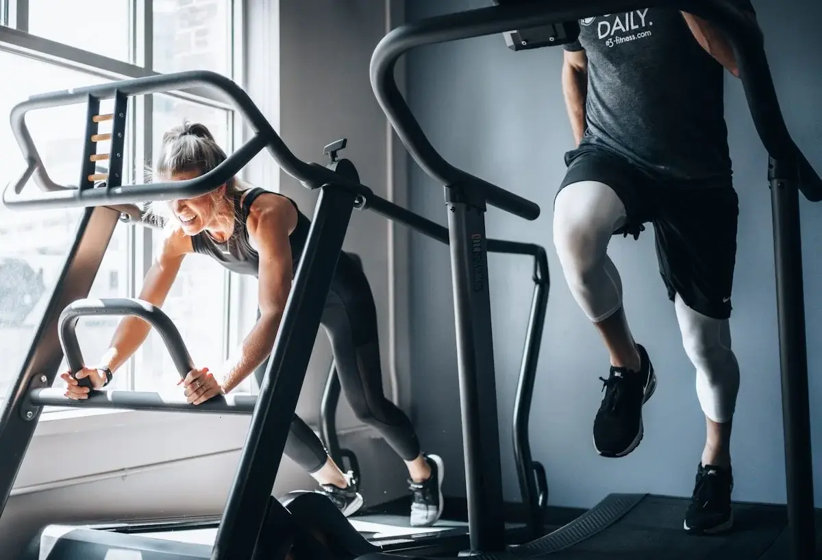 People using gym machines in a fitness club