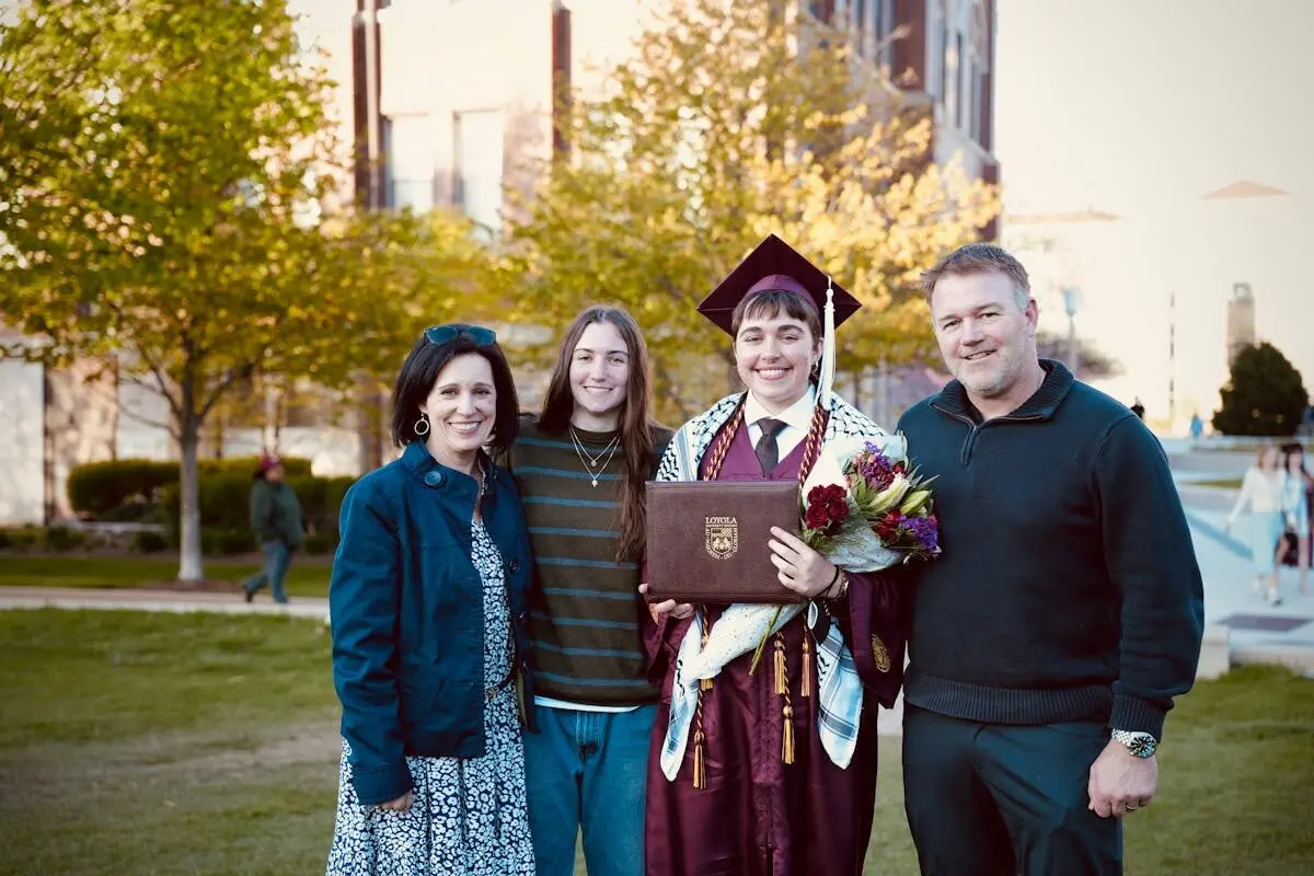 parents celebrate son's diploma