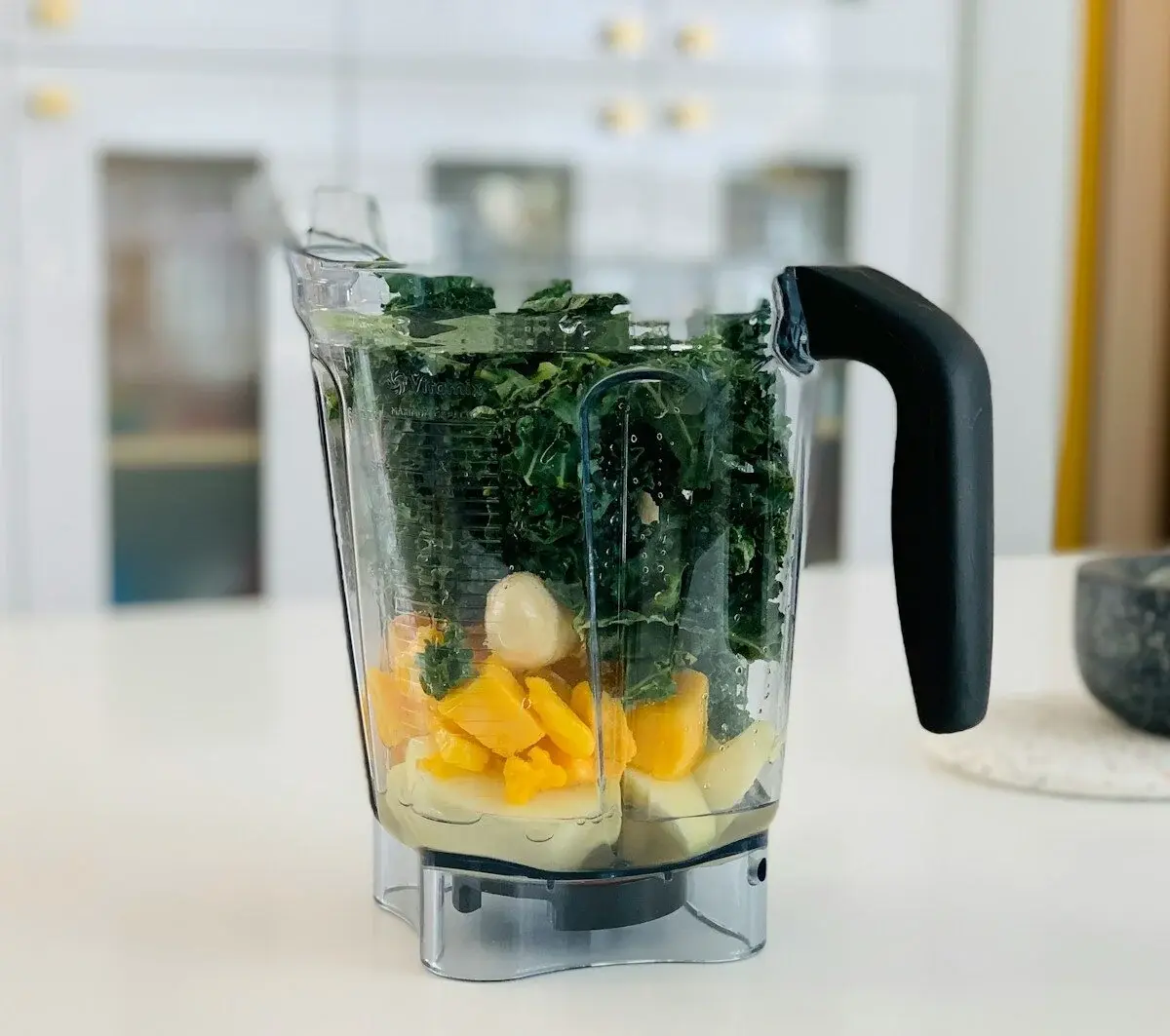 herbs and fruits in a blender