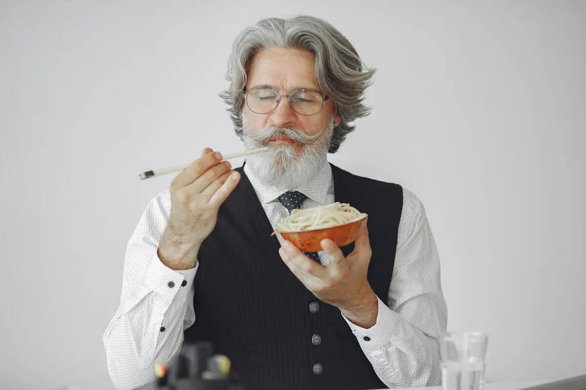 Eat Slower to Lose Weight: The Simple Habit That Cuts Calories 4 man eating with chopsticks