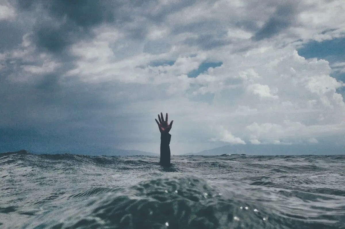 hand over water