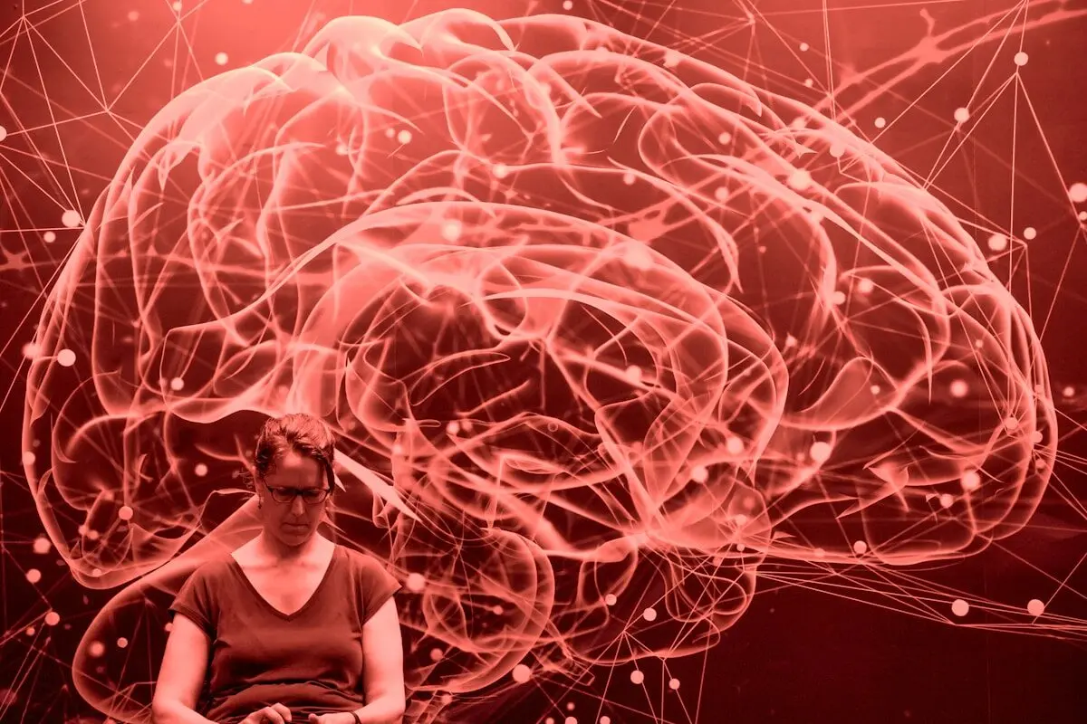Low Blood Pressure Can Triple Your Alzheimer’s Risk 4 woman in front of a brain image