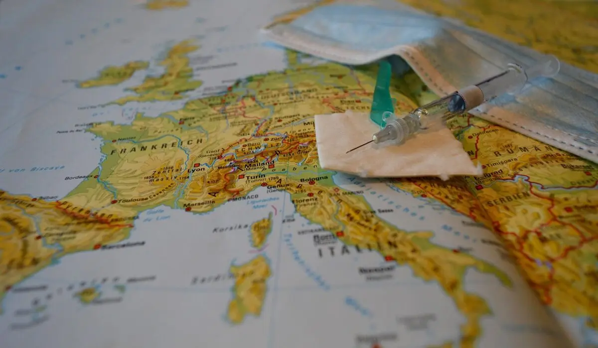 How QAnon and Other Conspiracies Tear Couples Apart 4 syringe with vaccine on a map