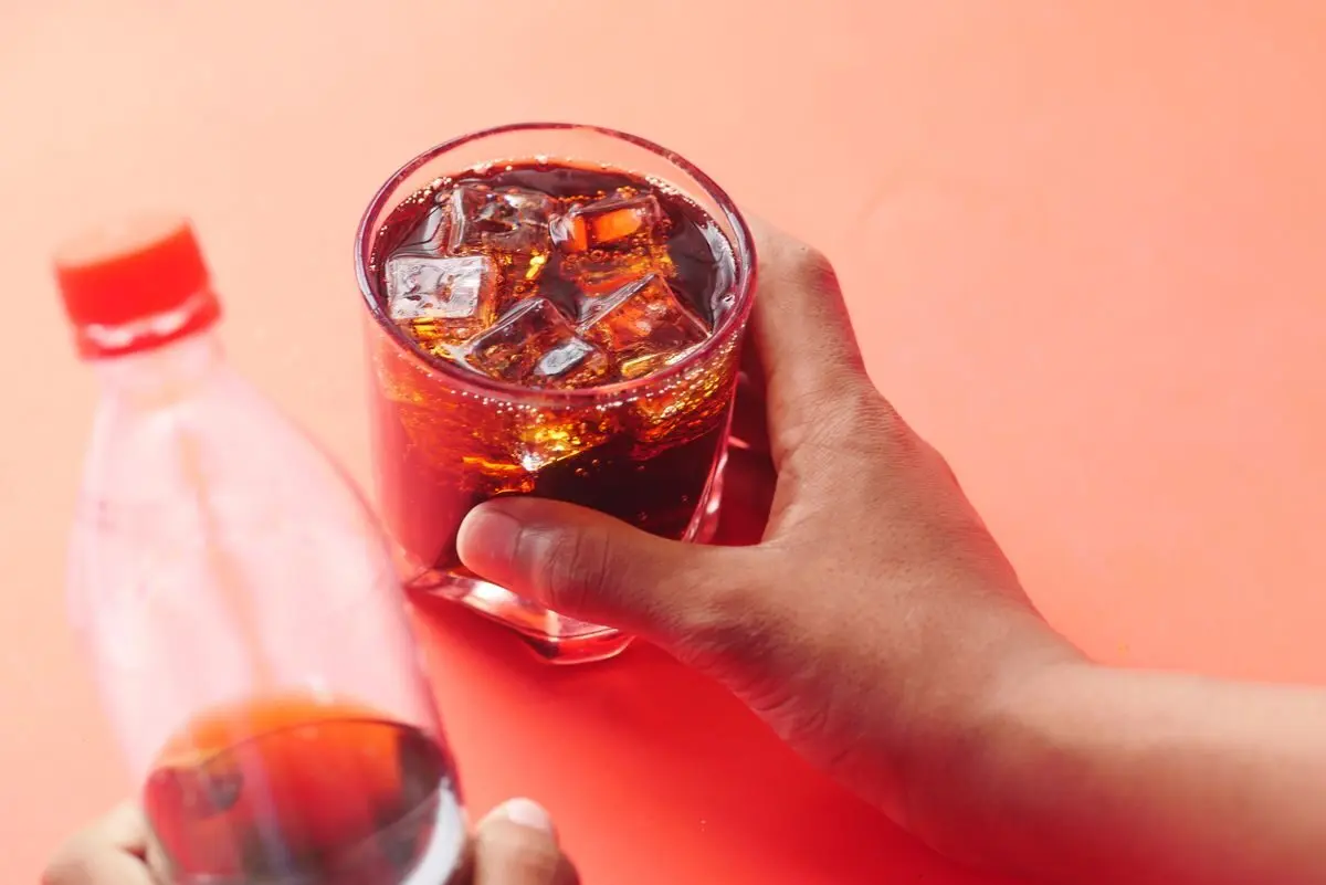 How Much Sugar Is Too Much, and When to Use Sweeteners 5 A bottle and a glass of Coca-Cola